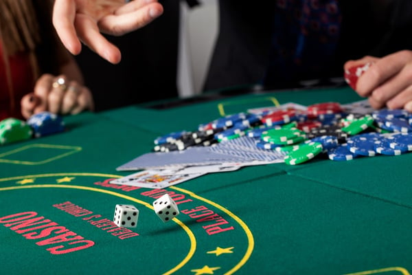 A closeup of throwing dice on a gambling table